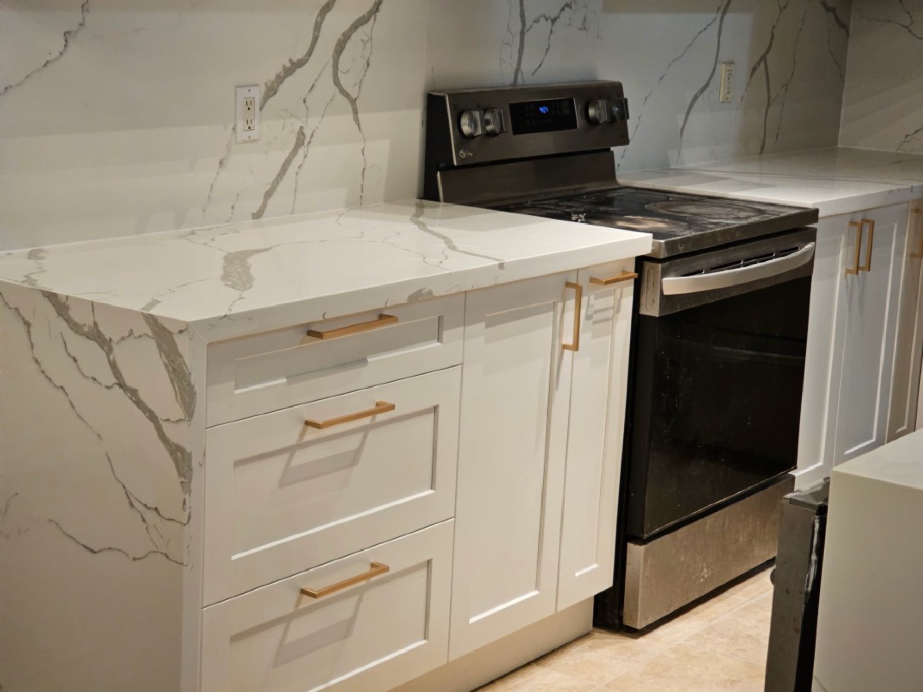 Waterfall countertop with stainless range installed